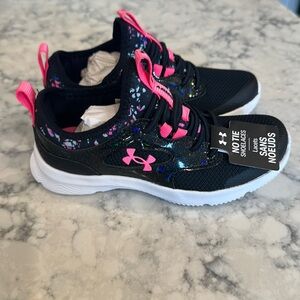 Girls size 12 Under Armour slip ons. New in box, never worn.